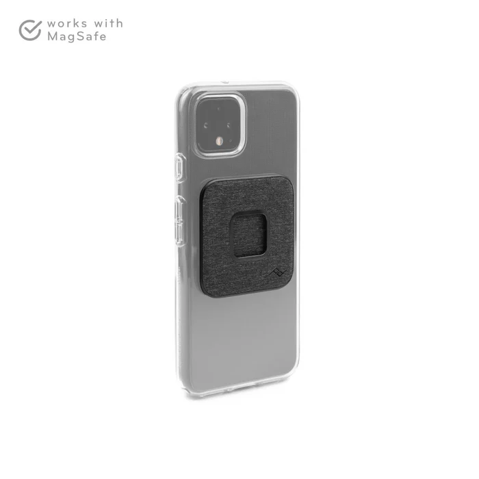 Peak Design Universal Adapter in Charcoal installed on a clear phone case