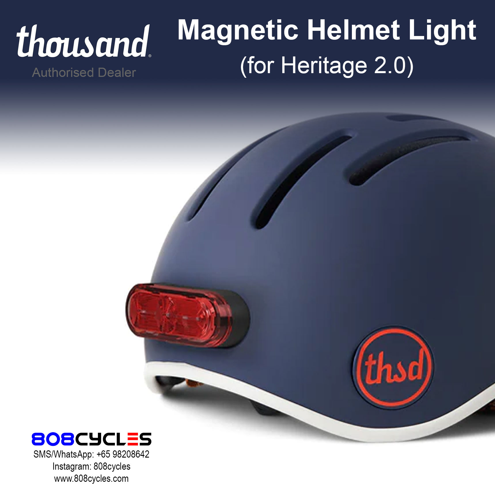 Thousand Magnetic Helmet Light mounted on the rear of a navy Heritage 2.0 bicycle helmet