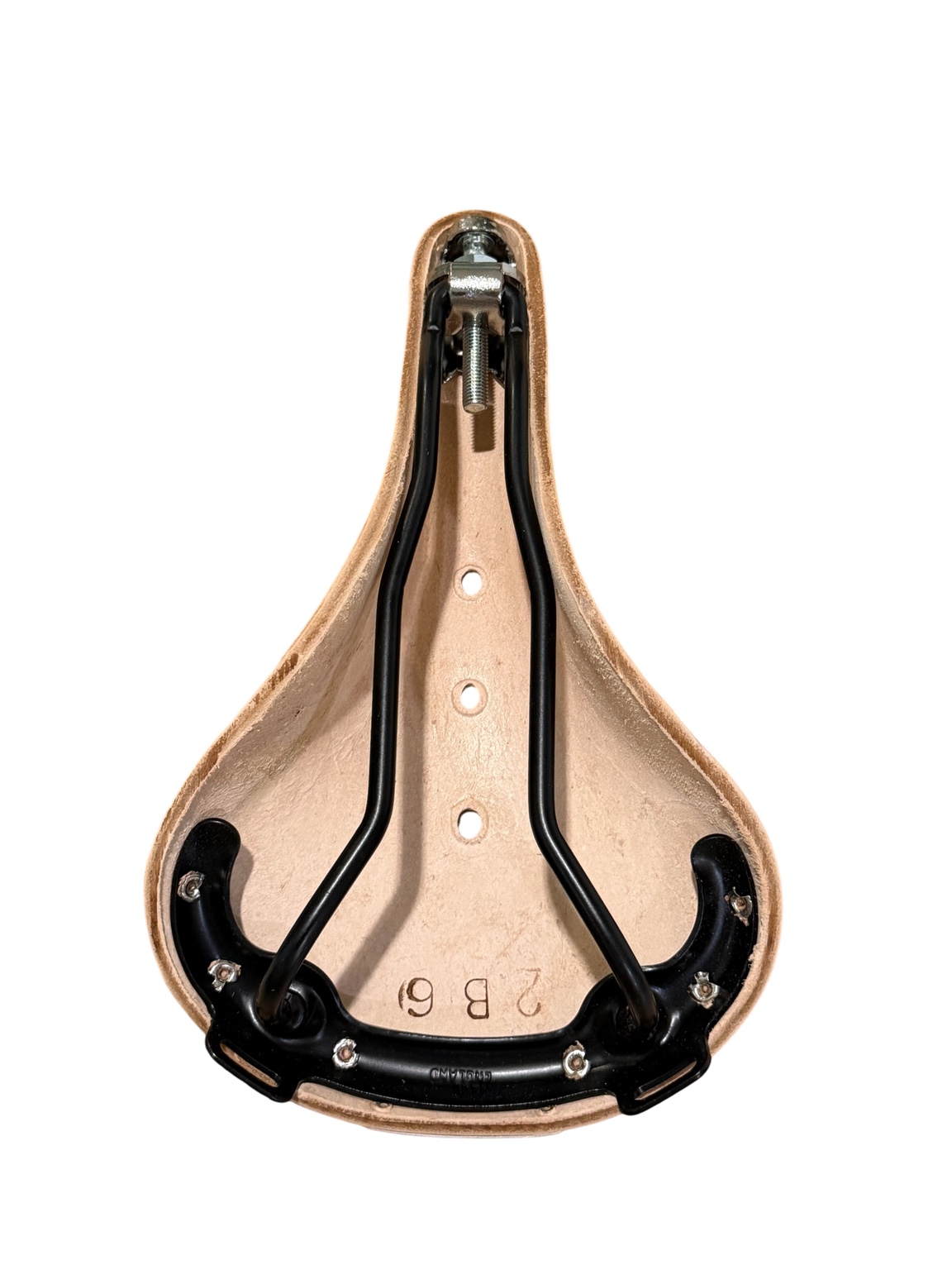 Underside of Brooks B17 White saddle showing black steel rails and tension bolt