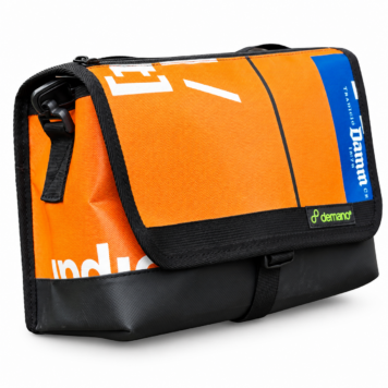 Demano Ribera 1703 orange and blue Brompton mini front bag with white banner lettering and black trim on white.