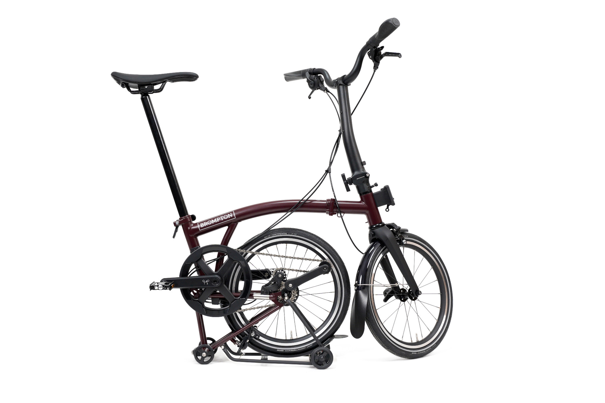 Brompton P Line Mk2 M4R Red Plum parked with rear wheel folded under and Mid handlebar raised